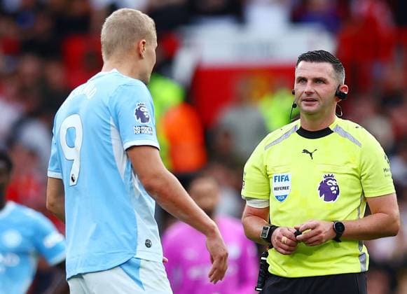 Referee Michael Oliver and Erling Haaland of Manchester City Manchester United, ManU v Manchester City, Premier League, Football, Football, Old Trafford, Manchester, UK - 13 Sep 2026Manchester Old Trafford United Kingdom EDITORIAL USE ONLY No use with unauthorised audio, video, data, fixture lists, club league logos or live services. Online in-match use limited to 120 images, no video emulation. No use in betting, games or single club league player publications. Copyright: xMattxWest Shutterstockx 17144604cy