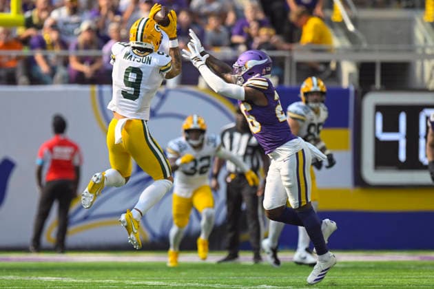 MINNEAPOLIS, MN - SEPTEMBER 13: Green Bay Packers wide receiver Christian Watson (9) catches a pass that would lead to an 81-yard touchdown reception as Minnesota Vikings safety Theo Jackson (26) defends during the first quarter of a NFL, American Football Herren, USA game between the Minnesota Vikings and Green Bay Packers on September 13, 2026, at U.S. Bank Stadium in Minneapolis MN. (Photo by Nick Wosika Icon Sportswire) NFL: SEP 13 Packers at Vikings EDITORIAL USE ONLY Icon20260913007