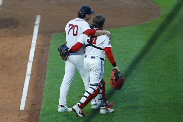 Boston Red Sox pitcher Payton Tolle is embraced by Boston Red Sox catcher Adley Rutschman, right, after finishing the fifth inning against the Kansas City Royals at Fenway Park in Boston, Massachusetts on Sunday, September 13, 2026.  BOP202609199 CJxGUNTHER
