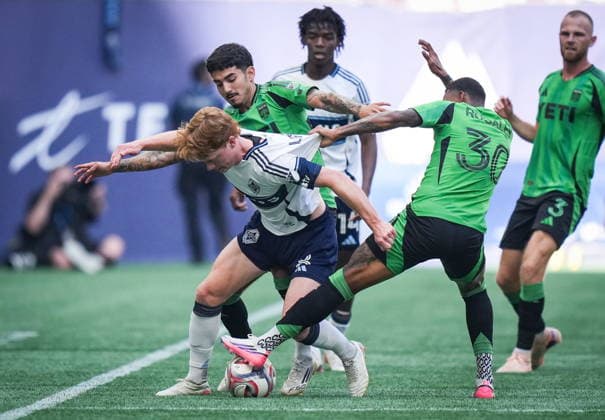September 13, 2026, Vancouver, Bc, CANADA: Vancouver Whitecaps Oliver Larraz (8) is grabbed by Austin FC s Joseph Rosales (30) and Ervin Torres (38) as they vie for the ball during the first half of an MLS, Fussball Herren, USA soccer match, in Vancouver, on Sunday, Sept. 13, 2026. Canada News - September 13, 2026 - ZUMAc35_ 20260913_zaf_c35_127 Copyright: xDarrylxDyckx