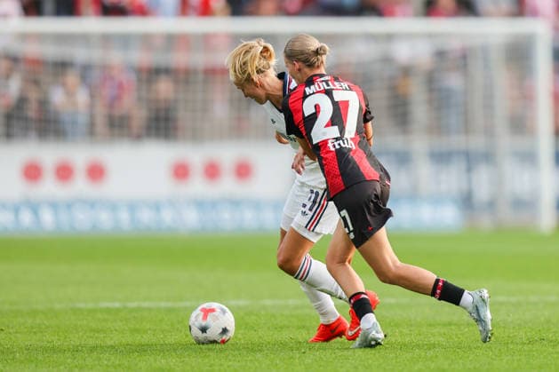Leverkusen, Germany - 14 September: Marlene Mueller of Bayern Leverkusen W and Pernille Harder of Bayern Munich W in action during the Bundesliga Women Round 4 match between Bayer Leverkusen W vs Bayern Munich W at Ulrich Haberland Stadion on 14 September 2026. Copyright: xOPAxImagesxJavadxMohammadpourx