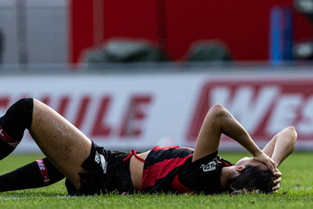 Google Pixel Frauen Bundesliga: Bayer 04 Leverkusen - FC Bayern München;14.09.2026 Selina Ostermeier (Bayer 04 Leverkusen, 2) liegt auf dem Rasen nach der Zweikampf. Frauen Bundesliga Google Pixel Frauen Bundesliga 26 27: Bayer 04 Leverkusen - FC Bayern München; Ulrich-Haberland-Stadion, Leverkusen; 14.09.2026 DFL regulations prohibit any use of photographs as image sequences and or quasi video.