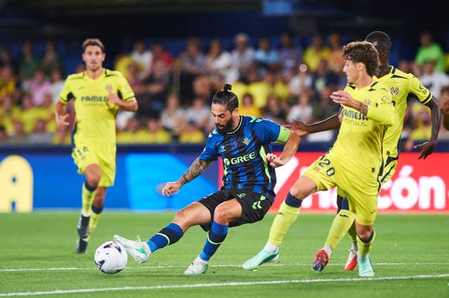 Isco Alarcon (Real Betis) and Carlos Romero (Villarreal CF) during the LaLiga EA Sports match between Villarreal CF and Real Betis Balompie at Estadio de la Ceramica on September 14, 2026 in Villarreal, Spain. -