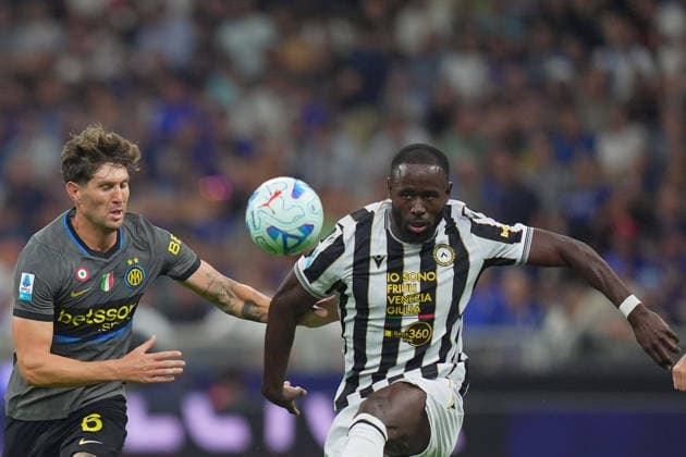 Inter Milan™s John Stones fights for the ball with Udinese s Keinan Davis during the Serie A soccer match between Fc Inter and Udinese the San Siro Stadium in Milan, north Italy - September 14 , 2026. - Soccer  Copyright: xSpada LaPressex