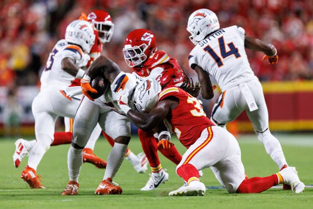 KANSAS CITY, MO - SEPTEMBER 14: Kansas City Chiefs linebacker Nick Bolton (32) tackles Denver Broncos running back RJ Harvey (12) during the first half on September 14th, 2026 at Arrowhead Stadium in Kansas City, Missouri. (Photo by William Purnell Icon Sportswire) NFL, American Football Herren, USA SEP 14 Broncos at Chiefs EDITORIAL USE ONLY Icon2026091401620