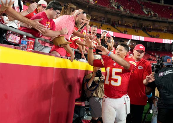Kansas City Chiefs quarterback Patrick Mahomes (15) is greeted by fans after the win against the Broncos on Monday Night Football at Arrowhead Stadium in Kansas City, Missouri on Monday September 14, 2026.  KCP2026091428 JONxROBICHAUD