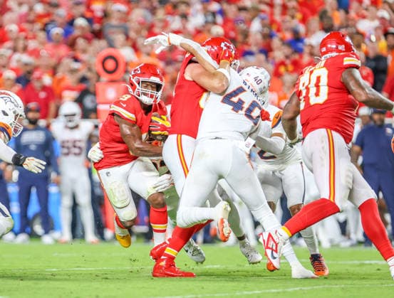 Sep 14, 2026:Kansas City Chiefs running back Kenneth Walker (9) tries to break a tackle against the Denver Broncos in Kansas City, MO, USA; at Arrowhead Stadium. Mandatory Credit: -Cal Media Kansas City USA - ZUMAc04_ 20260914_zma_c04_063 Copyright: xRomanxPunox