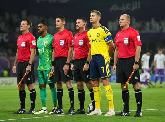 AL AIN, UNITED ARAB EMIRATES - SEPTEMBER 15: Cristiano Ronaldo of Al Nassr and Khalid Eisa of Al Ain FC line up alongside Uzbek match officials (L-R) Assistant Referee Andrey Tsapenko, Referee Ilgiz Tantashev, Fourth Official Timur Bazarov, and Assistant Referee Timur Gaynullin prior to the AFC Champions League Elite group stage match between Al Ain FC and Al Nassr at the Hazza bin Zayed Stadium on September 15, 2026 in Al Ain, United Arab Emirates. Al Ain vs. Al- Nassr - 2026 27 AFC Champions League Elite match 1 of 8 - West Region group at Hazza bin Zayed Stadium, Al Ain, UAE. 15 SEPTEMBER 2026 Copyright: xx