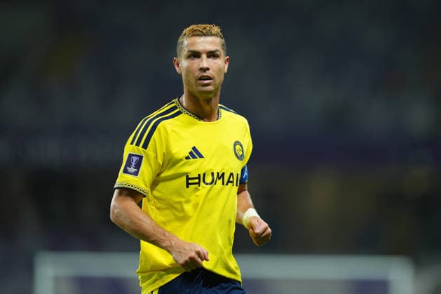 AL AIN, UNITED ARAB EMIRATES - SEPTEMBER 15: A portrait of Cristiano Ronaldo of Al Nassr during the AFC Champions League Elite group stage match between Al Ain FC and Al Nassr at the Hazza bin Zayed Stadium on September 15, 2026 in Al Ain, United Arab Emirates. The Portuguese forward is pictured in the yellow Al Nassr home kit featuring the HUMAIN sponsor logo and the captain s armband bearing the AFC logo. . Al Ain vs. Al- Nassr - 2026 27 AFC Champions League Elite match 1 of 8 - West Region group at Hazza bin Zayed Stadium, Al Ain, UAE. 15 SEPTEMBER 2026 Copyright: xx