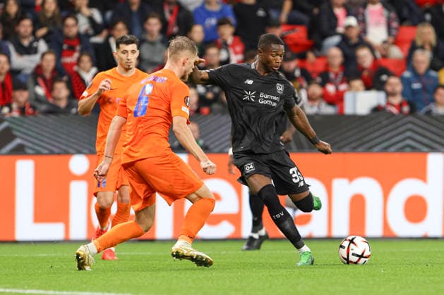 Artemijus TutyÅ¡kinas (NK Celje) und Christian Kofane (Bayer 04 Leverkusen) battle for the ball during the UEFA Europa League 2026 27 League Phase match between Bayer 04 Leverkusen and NK Celje at BayArena on September 16, 2026 in Leverkusen, Germany. (Photo by Oliver Kaelke DeFodi Images) -