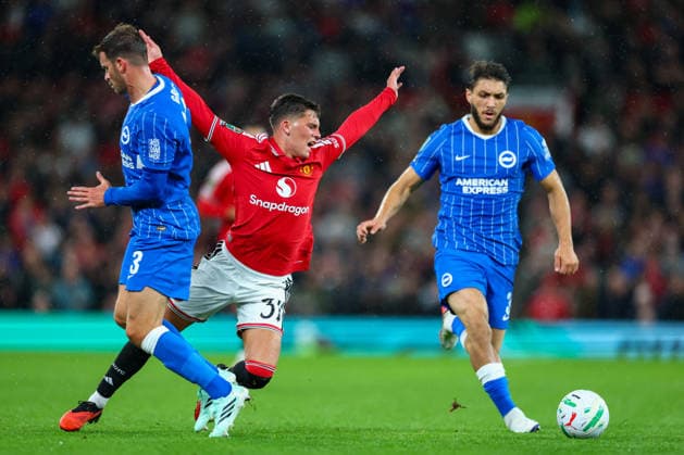 16th September 2026; Old Trafford, Manchester, England; Carabao Cup Football, Manchester United, ManU versus Brighton and Hove Albion; Shea Lacey of Manchester United goes down dramatically under pressure from Pascal Gross of Brighton and Hove Albion RogerxEvans