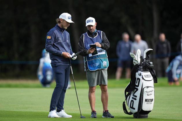 VIRGINIA WATER, ENGLAND - SEPTEMBER 17: Kristoffer Reitan (NOR) and his caddie discuss yardage on the 18th hole during Round 1 at the BMW PGA, Golf Herren Championship at Wentworth Golf Club, Virginia Water on September 17, 2026 in Surrey, England The BMW PGA Championship