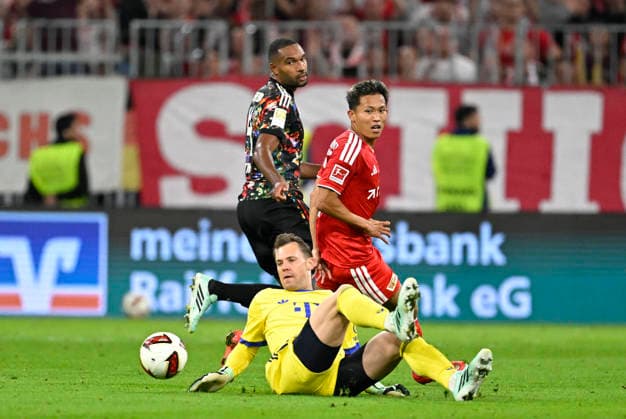 18.09.2026, Fussball Bundesliga 2026 2027, 4.Spieltag, FC Bayern München - 1.FC Union Berlin, in der Allianz-Arena München, Woo-yeong Jeong (Union Berlin) scheitert an Torwart Manuel Neuer (FC Bayern München)