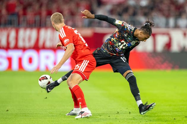 Michael Olise 17 (FC Bayern Muenchen) im Zweikampf mit Tom Rothe 15 (1. FC Union Berlin), FC Bayern Muenchen - 1. FC Union Berlin, Fussball Bundesliga, 4. Spieltag, 18.09.2026 DFB regulations prohibit any use of photographs as image sequences and or quasi-video Muenchen Bayern Deutschland