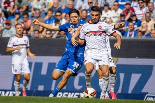 19.09.2026, xdaymx, Fussball 2.Bundesliga, Karlsruher SC - 1.FC Nürnberg. =vl. Pinto, Pedrosa Rafael (Karlsruher SC) im Zweikampf mit Alexios Kalegeropoulos (1.FC Nürnberg) (DFL DFB REGULATIONS PROHIBIT ANY USE OF PHOTOGRAPHS as IMAGE SEQUENCES and or QUASI-VIDEO) Karlsruhe