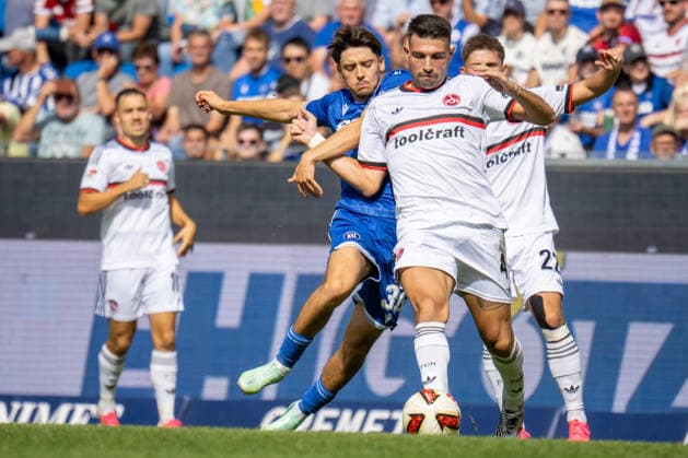 19.09.2026, xdaymx, Fussball 2.Bundesliga, Karlsruher SC - 1.FC Nürnberg. =vl. Pinto, Pedrosa Rafael (Karlsruher SC) im Zweikampf mit Alexios Kalegeropoulos (1.FC Nürnberg) (DFL DFB REGULATIONS PROHIBIT ANY USE OF PHOTOGRAPHS as IMAGE SEQUENCES and or QUASI-VIDEO) Karlsruhe