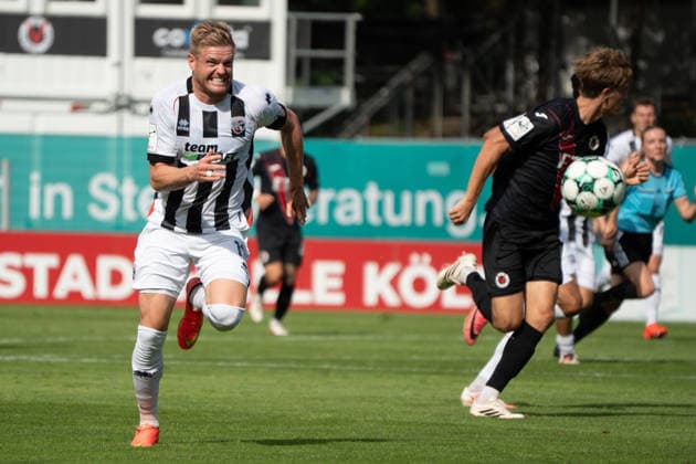 Deutschland: Fussball, 3. Liga, 2026 27, 7. Spieltag, 19.09.2026: FC Viktoria Köln vs. FC Ingolstadt 04: Sportpark Höhenberg (Köln): Lars Lokotsch (FC Ingolstadt 04, 13) beißt auf die Zähne um zum Ball zu sprinten Köln Deutschland Copyright: xMijoxLubecx