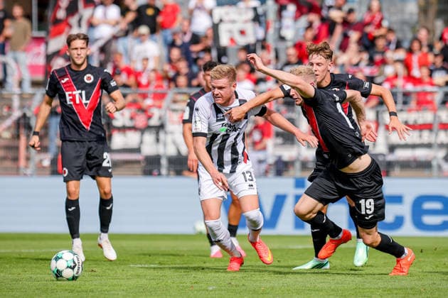 19.09.2026, xsefx, Fußball, FC Viktoria Köln - FC Ingolstadt 04, 3.Liga, Sportpark Höhenberg, 7. Spieltag, Saison 2026 2027: Lars Lokotsch (FC Ingolstadt 04 13) im Zweikampf gegen Meiko Sponsel (FC Viktoria Koeln 19) DFB regulations prohibit any use of photographs as image sequences and or quasi-video. Nordrhein-Westfalen Deutschland
