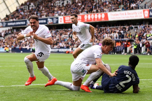 Millwall v West Ham United 19 September 2026, London - EFL Championship - Millwall v West Ham United - Konstantinos Mavropanos of West Ham United celebrates their second goal as Arne Engels of West Ham United shouts in the face of Jordi Osei-Tutu of Millwall - Photo: Jacques Feeney Offside. London UK Copyright: xJacquesxFeeneyx xOffsidexOffside