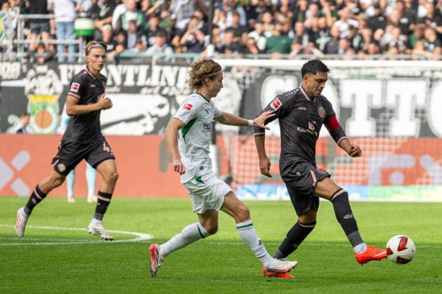 Zweikampf zwischen Hugo Bolin (Borussia Moenchengladbach, 38) und Nadiem Amiri (1. FSV Mainz 05, 10). Dahinter Kacper Potulski (1. FSV Mainz 05, 48). Borussia Moenchengladbach vs. 1. FSV Mainz 05, Fussball, 1. Bundesliga, 04. Spieltag, Saison 2026 2027, 19.09.2026 DFL DFB Regulations prohibit any use of Photographs as image sequences and or Quasivideo Borussia Moenchengladbach vs. 1. FSV Mainz 05, Fussball, 1. Bundesliga, 04. Spieltag, Saison 2026 2027, 19.09.2026 Moenchengladbach Copyright: xEibner-Pressefoto ThomasxHaeslerx EP_THR