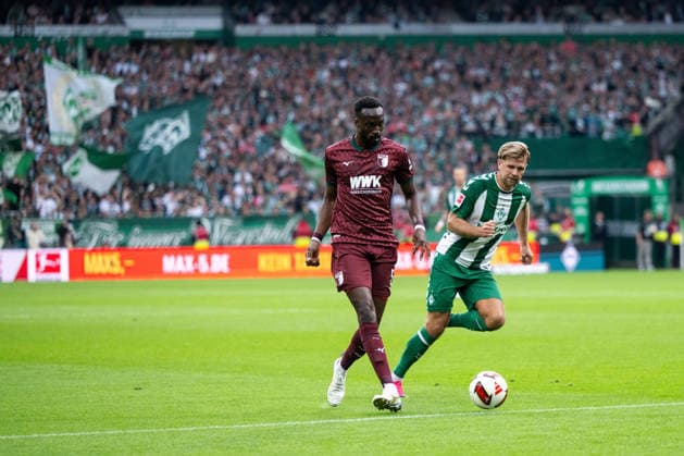 19.09.2026, GER, Fussball, Herren, 1. Bundesliga, Saison 2026 2027, 4. Spieltag, SV Werder Bremen vs. FC Augsburg Chrislain Matsima ( FC Augsburg, 05 ) im Zweikampf mit Niclas Füllkrug ( Werder Bremen, 10 ) DFB DFL regulations prohibit any use of photographs as image sequences and or quasi-video Bremen Weserstadion Bremen Deutschland Copyright: xNordphoto Memmlerx