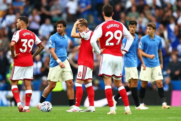 Martin Odegaard of Arsenal and team mates look dejected. Brighton & Hove Albion v Arsenal, Premier League, Football, American Express Stadium, Brighton, UK - 19 Sep 2026Brighton American Express Stadium United Kingdom EDITORIAL USE ONLY No use with unauthorised audio, video, data, fixture lists, club league logos or live services. Online in-match use limited to 120 images, no video emulation. No use in betting, games or single club league player publications. Copyright: xJamesxMarsh Shutterstockx 17158687ba