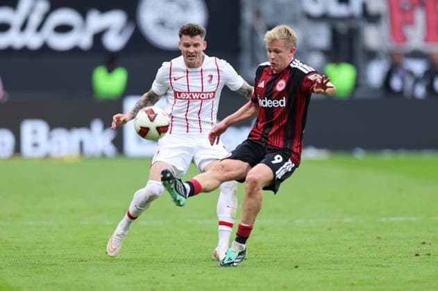 19.09.2026, Fussball Bundesliga, Eintracht Frankfurt - SC Freiburg, v.l., Lukas Kübler (SC Freiburg), Jonathan Burkardt (Eintracht Frankfurt) DFL DFB REGULATIONS PROHIBIT ANY USE OF PHOTOGRAPHS AS IMAGE SEQUENCES AND OR QUASI-VIDEO. xdcx Copyright: HMBxMedia Claus