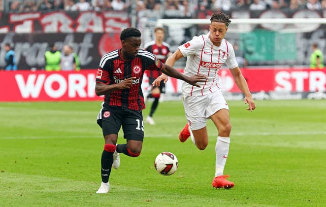 19.09.2026, xovx, Fußball Fußball Bundesliga, Eintracht Frankfurt - SC Freiburg v.l. Noel Aseko (Eintracht Frankfurt), Derry Scherhant (SC Freiburg) (DFL DFB REGULATIONS PROHIBIT ANY USE OF PHOTOGRAPHS as IMAGE SEQUENCES and or QUASI-VIDEO) emspor Frankfurt