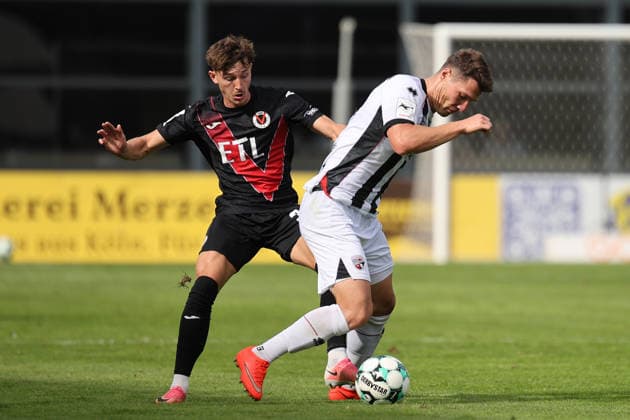 19.09.2026, xsefx, Fußball, FC Viktoria Köln - FC Ingolstadt 04, 3.Liga, Sportpark Höhenberg, 7. Spieltag, Saison 2026 2027: Jonas Scholz (FC Ingolstadt 04 15) im Zweikampf gegen Alexander Prokopenko (FC Viktoria Koeln 30) DFB regulations prohibit any use of photographs as image sequences and or quasi-video. Nordrhein-Westfalen Deutschland