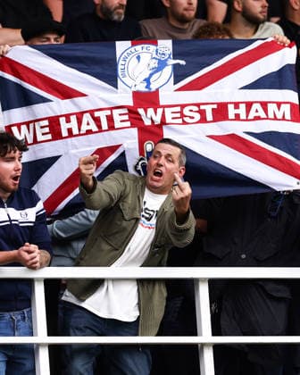 Millwall v West Ham United 19 September 2026, London - EFL Championship - Millwall v West Ham United - A Millwall fan swears in front of a We Hate West Ham flag - Photo: Jacques Feeney Offside. London UK Copyright: xJacquesxFeeneyx xOffsidexOffside