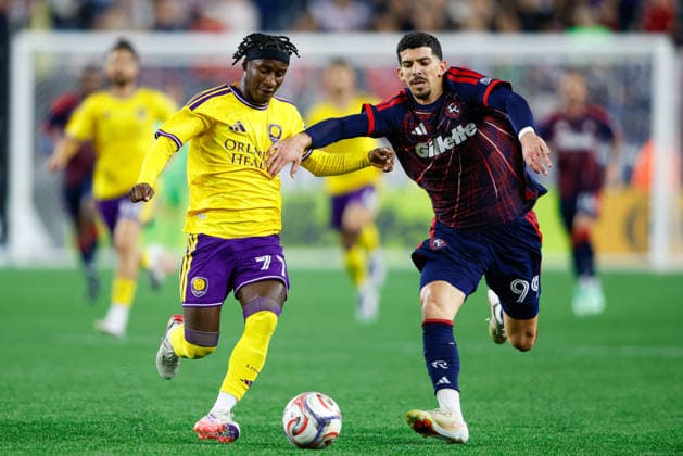 September 19, 2026; Foxborough, Massachusetts, USA; Orlando City SC Forward Ivan Angulo (77) and New England Revolution forward Dor Turgeman (99) race towards the ball in a Major League Soccer game at Gillette Stadium. (c) CSM - ZUMAc04_ 20260919_zma_c04_314 Copyright: xBurtxGranofskyx