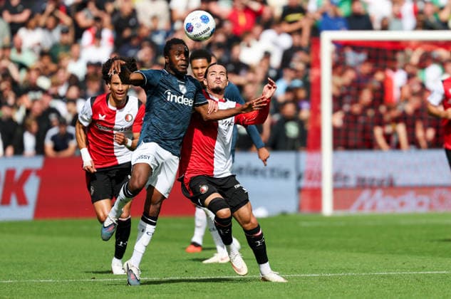 2026-09-20 Feyenoord v FC Utrecht - Dutch Eredivisie ROTTERDAM, NETHERLANDS - SEPTEMBER 20: Athur Zagre of FC Utrecht wins the headed ball of Anis Hadj Moussa of Feyenoord during the Dutch Eredivisie match between Feyenoord and FC Utrecht at Stadion Feijenoord on September 20, 2026 in Rotterdam, Netherlands. Rotterdam Stadion Feijenoord Netherlands Content not available for redistribution in The Netherlands directly or indirectly through any third parties. Copyright: xHansxvanxderxValkx