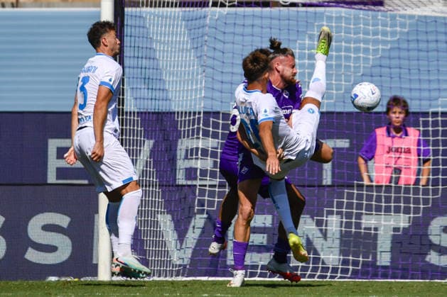 IPA88758196 - Lorenzo Lucca (Napoli) battles for the ball against Radu Matei Dragusin (Fiorentina) during the ACF Fiorentina vs. SSC Napoli Italian Serie A soccer match in Florence, Italy, on September 20, 2026  Copyright: xFabioxFagiolini IPAxSportx xx IPA88758196