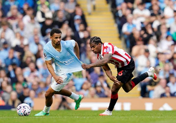 Manchester, England, 20th September 2026. Dayann Methalie of Sunderland gets to grips with Illiman Ndiaaye of Manchester City during the Manchester City vs Sunderland Premier League match at the Etihad Stadium, Manchester. Picture credit should read: Andrew Yates Sportimage EDITORIAL USE ONLY. No use with unauthorised audio, video, data, fixture lists, club league logos or live services. Online in-match use limited to 120 images, no video emulation. No use in betting, games or single club league player publications. SPI_053_AY_ManCity_Sunderland SPI-5012-0053
