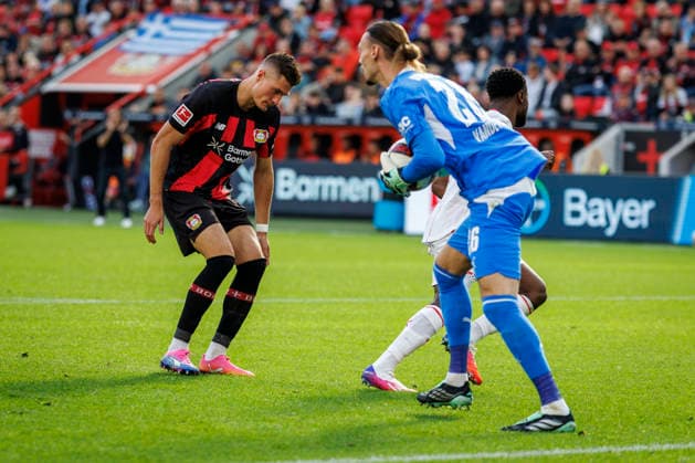 LEVERKUSEN, GERMANY - SEPTEMBER 20, 2026:Keeper Maarten Vandevoordt (RB Leipzig, 26) saves the ball before Patrik Schick (Bayer 04 Leverkusen, 14) during the German Bundesliga match on gameday 4 between Bayer 04 Leverkusen vs. RB Leipzig at BayArena on September 20, 2026 in Leverkusen, Germany. DFL REGULATIONS PROHIBIT ANY USE OF PHOTOGRAPHS AS IMAGE SEQUENCES AND OR QUASI-VIDEO. Northrhine-Westphalia Germany Copyright: xAxelxKohringx