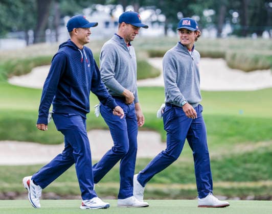 Colin Morikawa of the US (L) Justin Thomas of the US (C) and Jackson Koivun of the US (R) walk up the fourteenth fairway during practice for the Presidents Cup golf tournament at Medinah Country Club in Medinah, Illinois on Monday, September 21, 2026. Competition between the USA and the International team begins on Thursday, September 24 with Four-Ball play.  MED20260922801 TANNENxMAURY