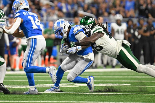 Sep 27, 2026; Detroit, MI, USA; Detroit Lions running back Jahmyr Gibbs (0) gets wrapped up by New York Jets linebacker Demario Davis (56) at Ford Field. Mandatory Credit: -Cal Media Detroit USA - ZUMAc04_ 20260927_zma_c04_021 Copyright: xAllanxDranbergx