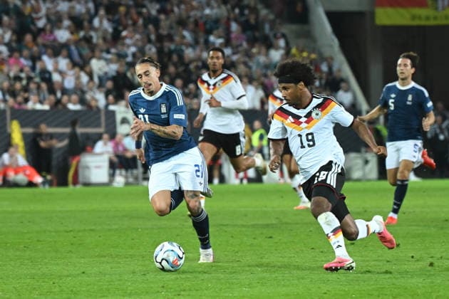 27.09.2026, xemx, Fussball UEFA Nations League, Deutschland - Griechenland v.l. Konstantinos Tsimikas (Griechenland) Karim Adeyemi (Deutsche Fussball Nationalmannschaft DFB) Augsburg