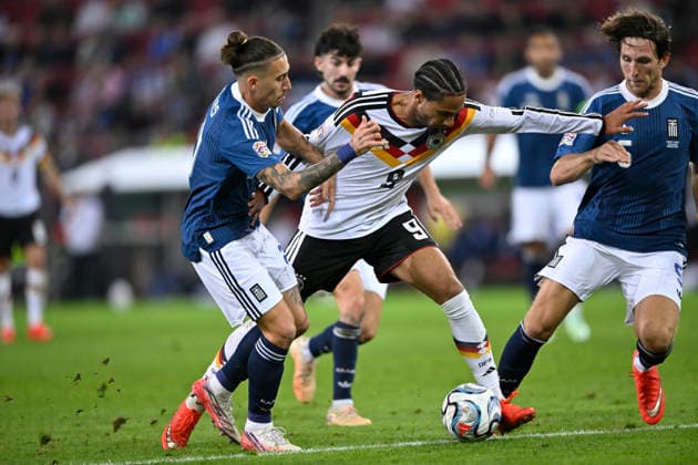 Zweikampf, Aktion Kevin Schade GER (09) Kostas Tsimikas GRE (21) DFB Laenderspiel Deutschland GER vs Griechenland GRE UEFA Nations League am 27.09.2026 DFL REGULATIONS PROHIBIT ANY USE OF PHOTOGRAPHS AS IMAGE SEQUENCES AND OR QUASI-VIDEO DFB Laenderspiel Deutschland GER vs Griechenland GRE UEFA Nations League