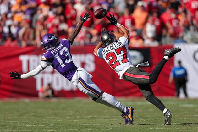 Sep 27, 2026; Tampa, FL, USA; Tampa Bay Buccaneers cornerback Zyon McCollum (27) attempts to intercept a pass intended for Minnesota Vikings wide receiver Tai Felton (13) during an NFL, American Football Herren, USA football game between the Minnesota Vikings and Tampa Bay Buccaneers at Raymond James Stadium in Tampa, Florida. Mandatory Credit: Taylor McFee-Cal Media NFL 2026: Vikings Vs Buccaneers SEP 27  - ZUMAc04_ 20260927_zma_c04_077 Copyright: xTaylorxMcfeex