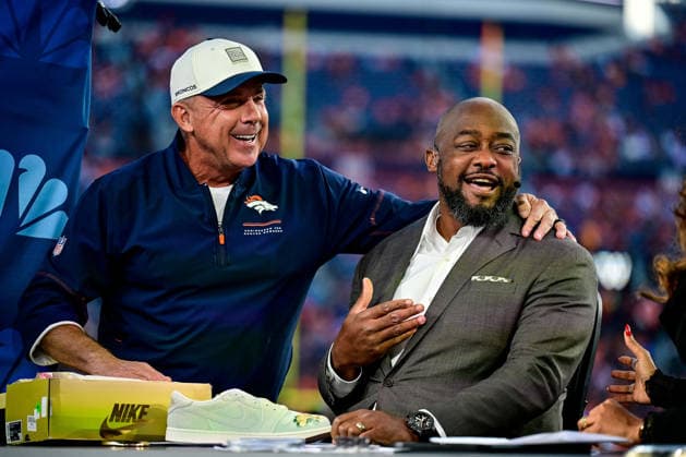 DENVER, CO - SEPTEMBER 27: Denver Broncos head coach Sean Payton visits with Mike Tomlin, the former Pittsburgh Steelers head coach, as he gifts him a pair of Nike shoes during the Football Night in America broadcast before a game between the Los Angeles Rams and the Denver Broncos at Empower Field at Mile High on September 27, 2026 in Denver, Colorado. (Photo by Dustin Bradford Icon Sportswire) NFL, American Football Herren, USA SEP 27 Rams at Broncos EDITORIAL USE ONLY Icon132260927004