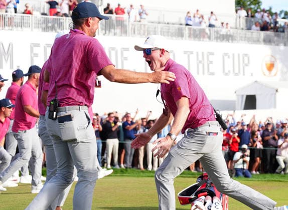 MEDINAH, IL - SEPTEMBER 27: Team USA captain Brandt Snedeker on right celebrates with vice captain Keegan Bradley on the 18th green when USA clinches the Presidents Cup during the round five singles matches of the 2026 Presidents Cup on September 27, 2026, at Medinah Country Club in Medinah, Illinois. (Photo by Brian Spurlock Icon Sportswire) GOLF: SEP 27 Presidents Cup EDITORIAL USE ONLY Icon26092760