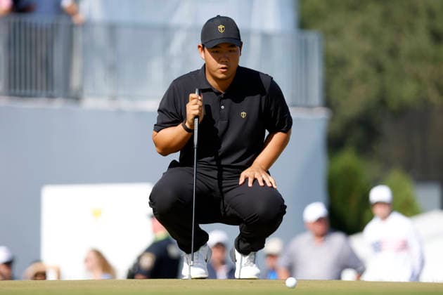 MEDINAH, IL - SEPTEMBER 27: Tom Kim of South Korea squats to read a putt on No. 15 during the Sunday singles session of the Presidents Cup, September 27, 2026, at Medinah Country Club in Medinah, Illinois. (Photo by Matthew Maxey Icon Sportswire) GOLF: SEP 27 Presidents Cup EDITORIAL USE ONLY Icon260927070