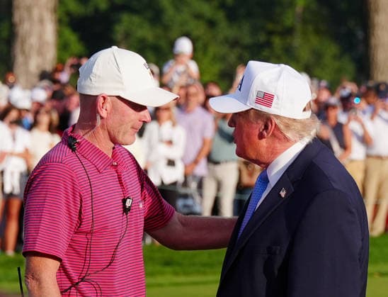 MEDINAH, IL - SEPTEMBER 27: The 45th and 47th President of the United States Donald J. Trump talks with Team USA captain Brandt Snedeker at the closing ceremony on the 14th hole after Team USA won the Presidents Cup during the round five singles matches of the 2026 Presidents Cup on September 27, 2026, at Medinah Country Club in Medinah, Illinois. (Photo by Brian Spurlock Icon Sportswire) GOLF: SEP 27 Presidents Cup EDITORIAL USE ONLY Icon26092786