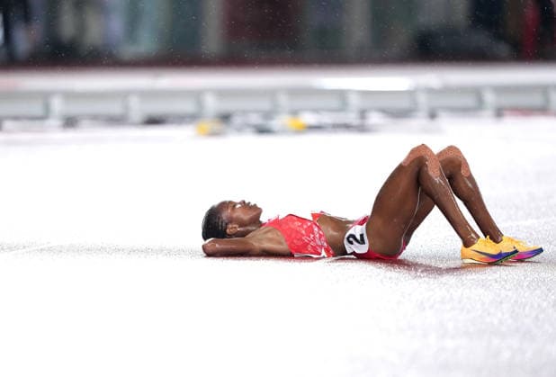 (260928) -- NAGOYA, Sept. 28, 2026 -- Winfred Yavi of Bahrain reacts after the women s 5000m final match of Athletics at the 20th Asian Games Aichi-Nagoya 2026 in Nagoya, Japan, Sept. 28, 2026. ) (SP)JAPAN-NAGOYA-ASIAN GAMES-ATHLETICS-WOMEN S 5000M JiaxYuchen 