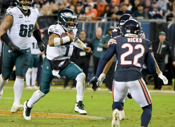 Philadelphia Eagles quarterback Jalen Hurts (1) scrambles up the middle with the ball against the Chicago Bears at Soldier Field in Chicago on Monday, September 28, 2026. Bears defeated the Eagles 27-7.  CHI20260928120 MARKxBLACK