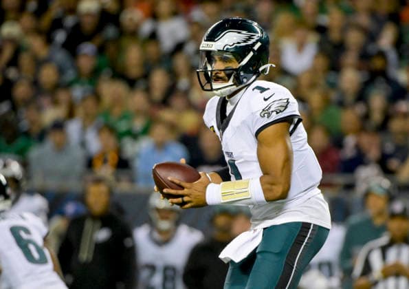 Philadelphia Eagles quarterback Jalen Hurts (1) takes the snap against the Chicago Bears during a game at Soldier Field in Chicago on Monday, September 28, 2026. Bears defeated the Eagles 27-7.  CHI20260928124 MARKxBLACK