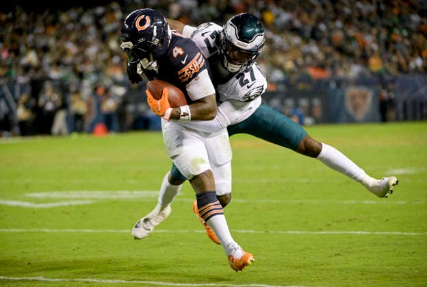 Chicago Bears safety Dillon Thieneman (31) is tackled by Philadelphia Eagles cornerback Quinyon Mitchell (27) during the first half at Soldier Field in Chicago on Monday, September 28, 2026. Bears defeated the Eagles 27-7.  CHI20260928136 MARKxBLACK