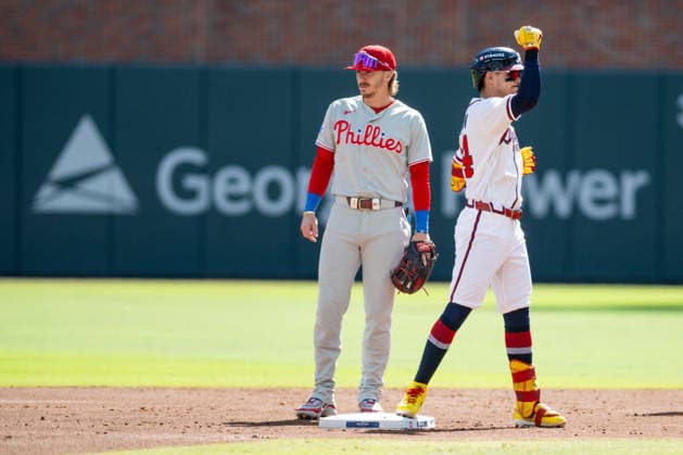 Mauricio Dubón 14 of the Atlanta Braves celebrates getting on base in game one of the MLB, Baseball Herren, USA National League Wild Card round against the Philadelphia Phillies at Truist Park on Tuesday, September 29, 2026 in Atlanta, Georgia.  ATL20260928116 JULIANxALEXANDER