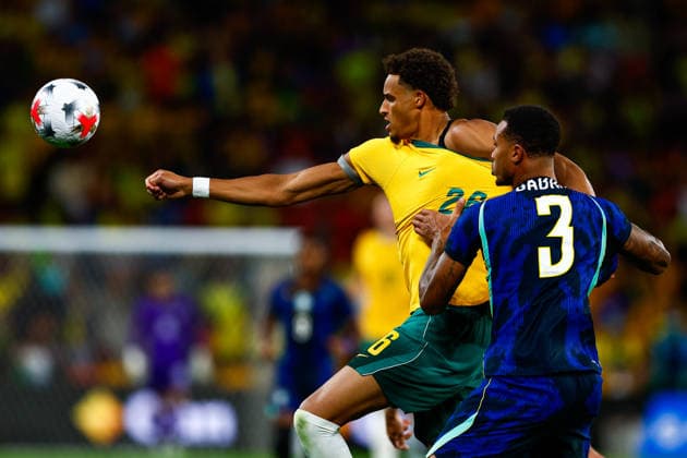 SOCCER AUSTRALIA BRAZIL, Tete Yengi of Australia and Gabriel Magalhaes of Brazil compete for the ball during the Queensland Football Series International Friendly, Länderspiel, Nationalmannschaft match between the Socceroos and Brazil at Suncorp Stadium in Brisbane, Tuesday, September 29, 2026. ( NO ARCHIVING, EDITORIAL USE ONLY  Copyright: xRUSSELLxFREEMANx 20260930140158172026